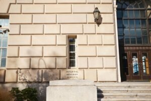 The entrance of the Internal Revenue Service building, with its name carved in stone.